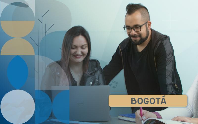 Two people working on a computer.